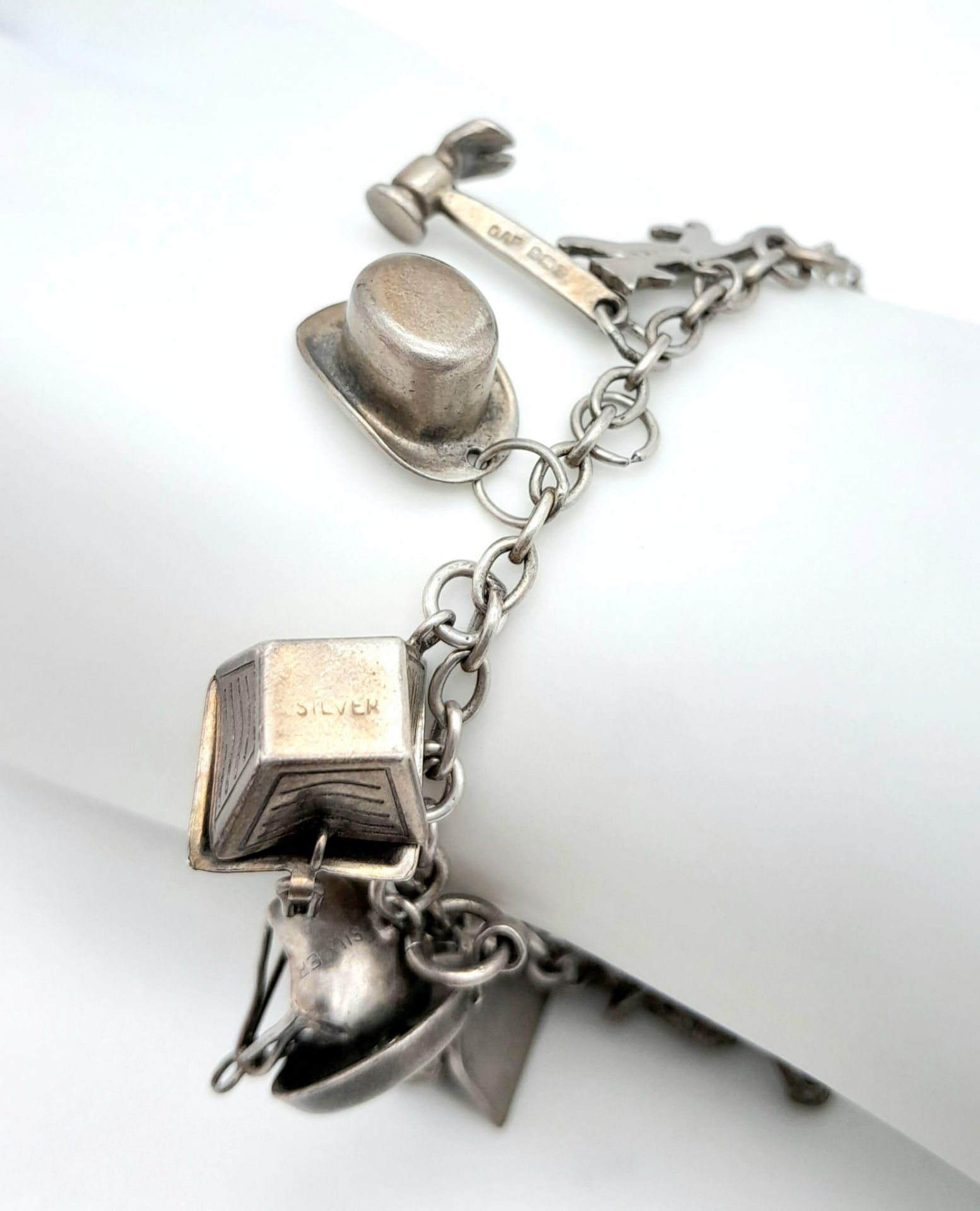 A Sterling Silver Charm Bracelet with 23 Charms. 18cm length, 48.5g total weight. Ref: SC 7088 - Image 3 of 5