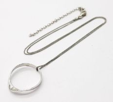 A 925 silver ring pendant on silver chain. Total weight 2.7G. Total length 43cm.