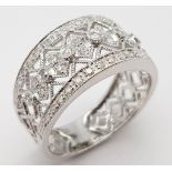 A 9K WHITE GOLD DIAMOND SET, WIDE OPEN-WORK DESIGN BAND RING. 3.3G. SIZE P.