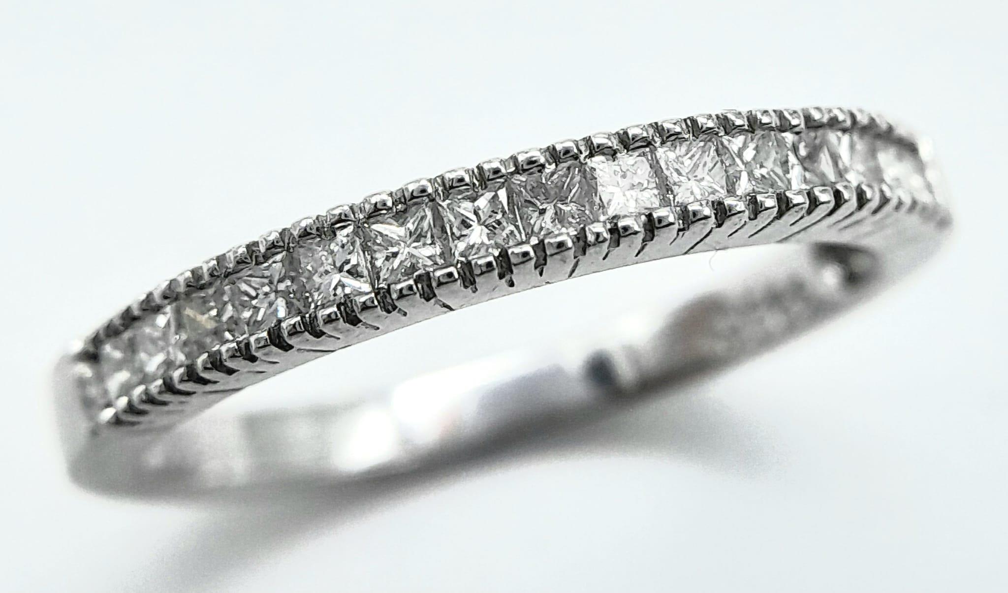 AN 18K WHITE GOLD DIAMOND SET BAND RING - PRINCESS CUTS. 0.50CTW. 2.8G. SIZE P 1/2. - Image 2 of 6