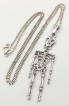 A 925 silver articulated skeleton on Italy silver curb chain. Total weight 5.9G. Total length 42cm.