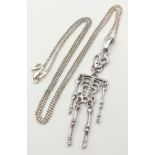 A 925 silver articulated skeleton on Italy silver curb chain. Total weight 5.9G. Total length 42cm.