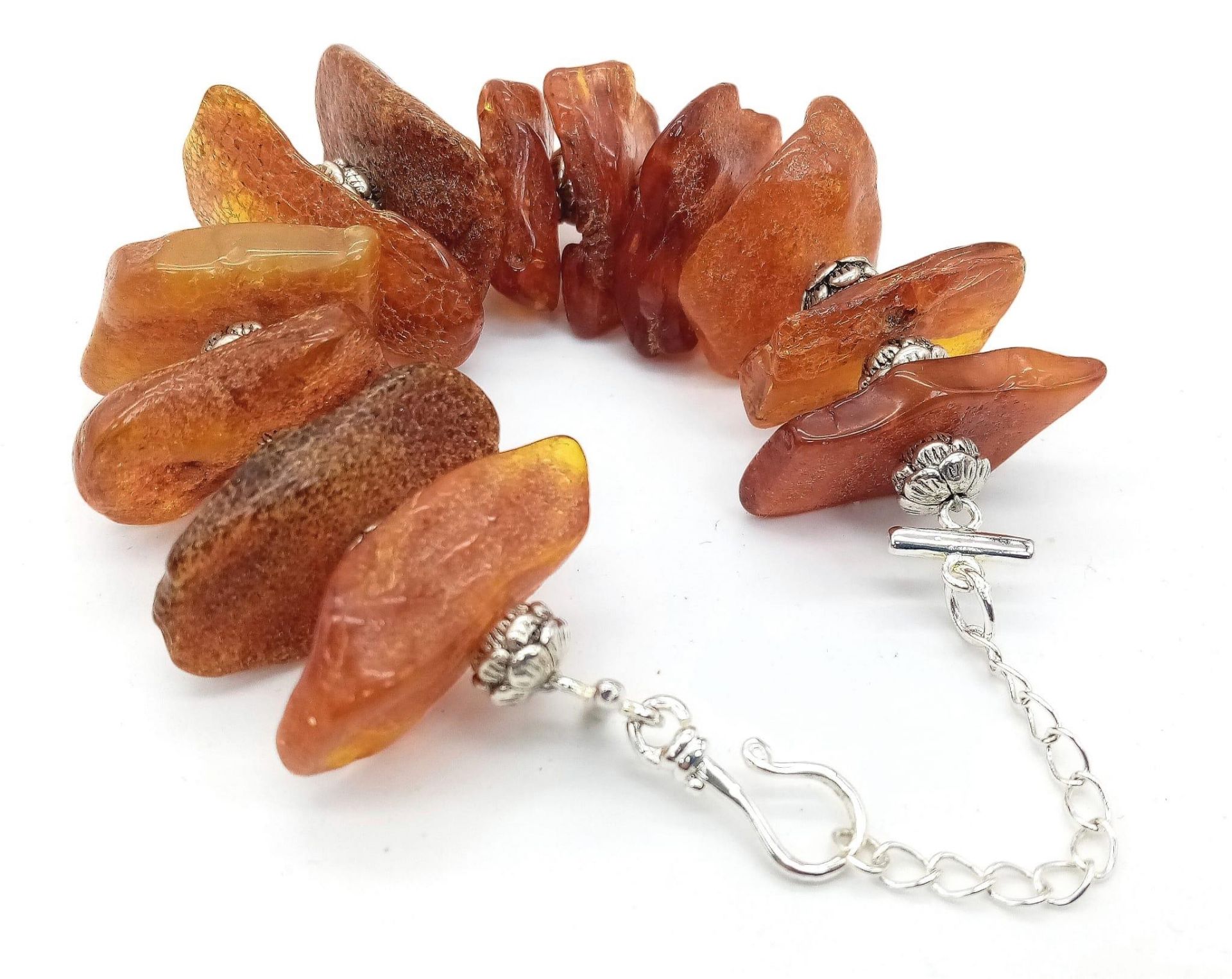 An interesting bracelet consisting of large, 100% natural, cognac coloured, Baltic amber nuggets, in - Bild 2 aus 4