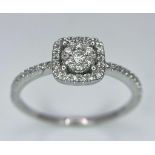 A 9K WHITE GOLD STONE SET RING . 1.9gms size N