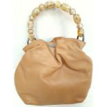 A Christian Dior Tan 'Maris' Hand Bag. Leather exterior with silver-toned hardware, beaded handle,