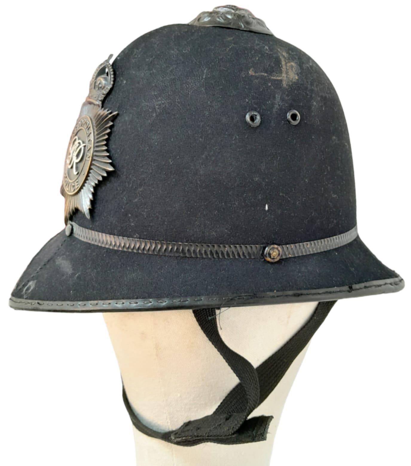 A British Metropolitan Police Helmet. Complete with original badge. - Image 2 of 5