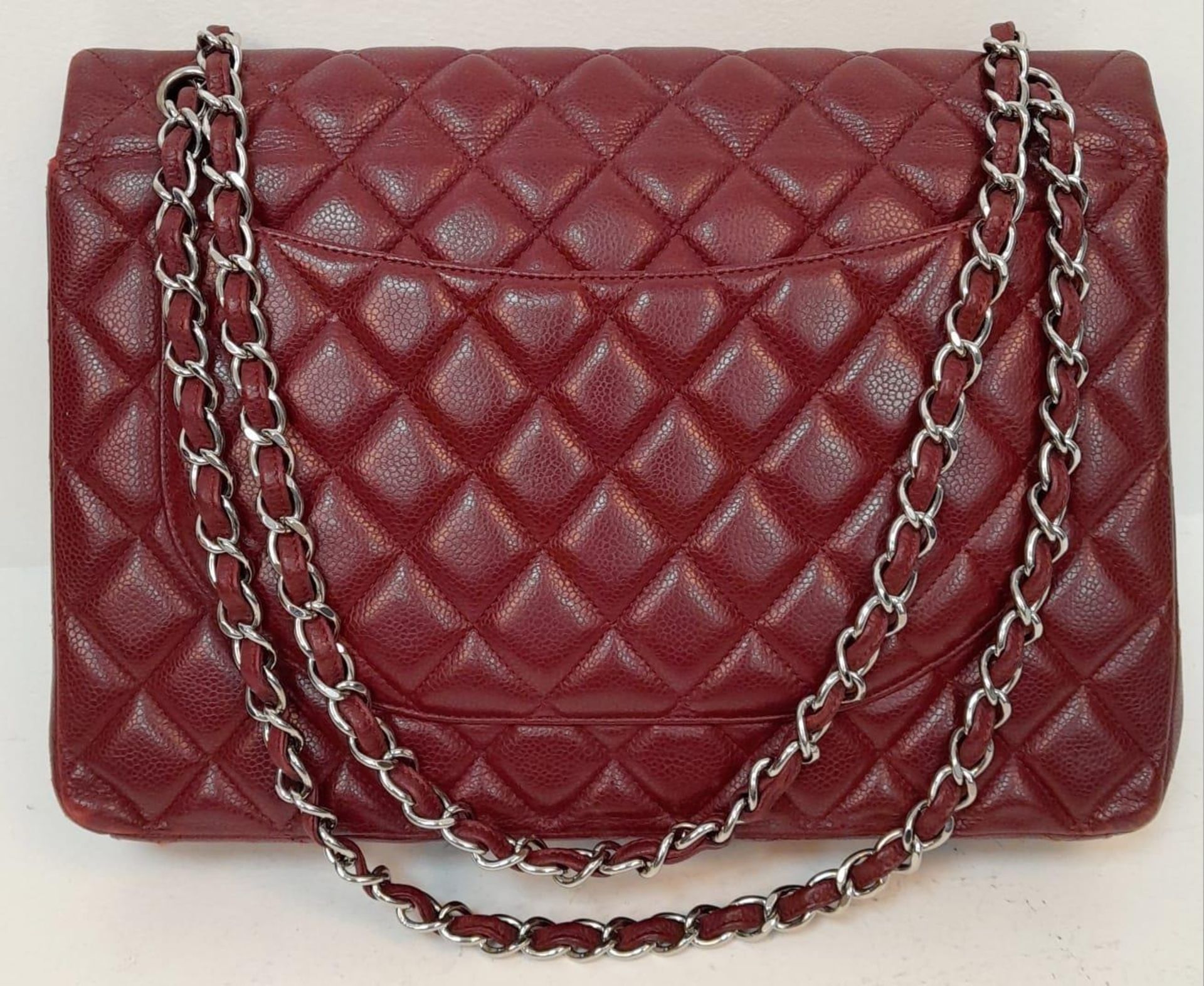 A Chanel Burgundy Jumbo Classic Double Flap Bag. Quilted leather exterior with silver-toned - Bild 5 aus 16