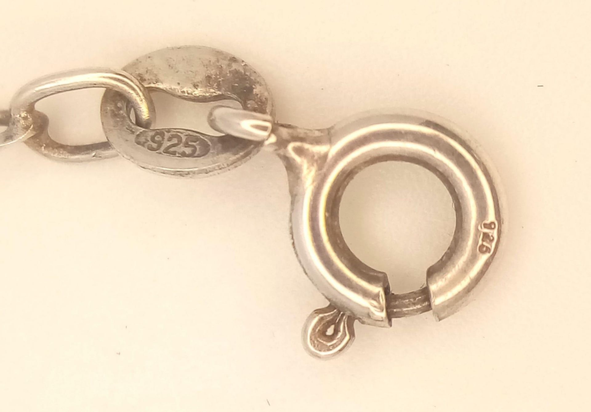 A collection of 4 stylist sterling silver bracelets include a figaro link, twisted, heart link and - Image 13 of 13