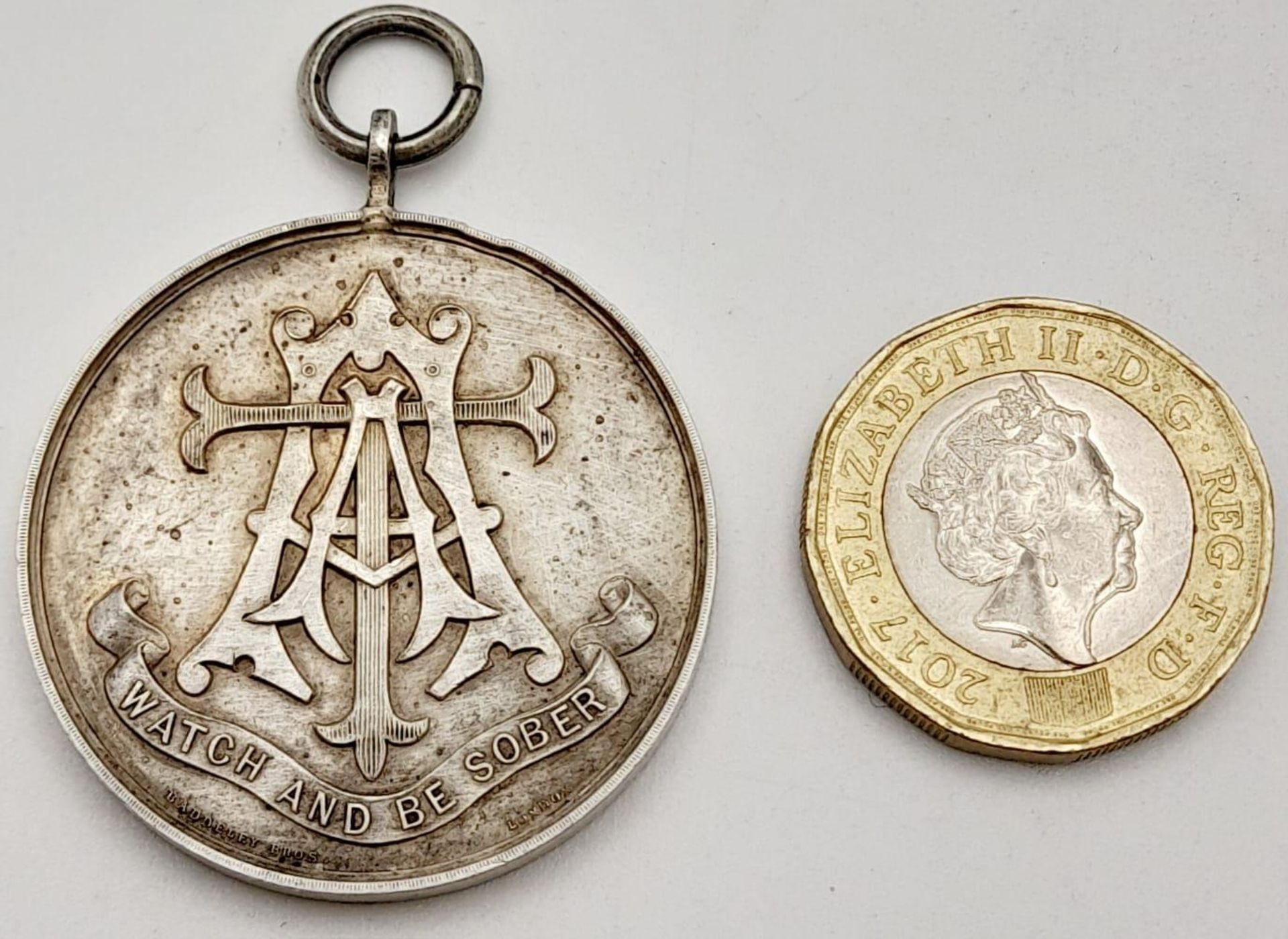 A Silver 1893 Dated Army Temperance Medal Issued by Badderley Bros. London. These medal were - Image 9 of 13