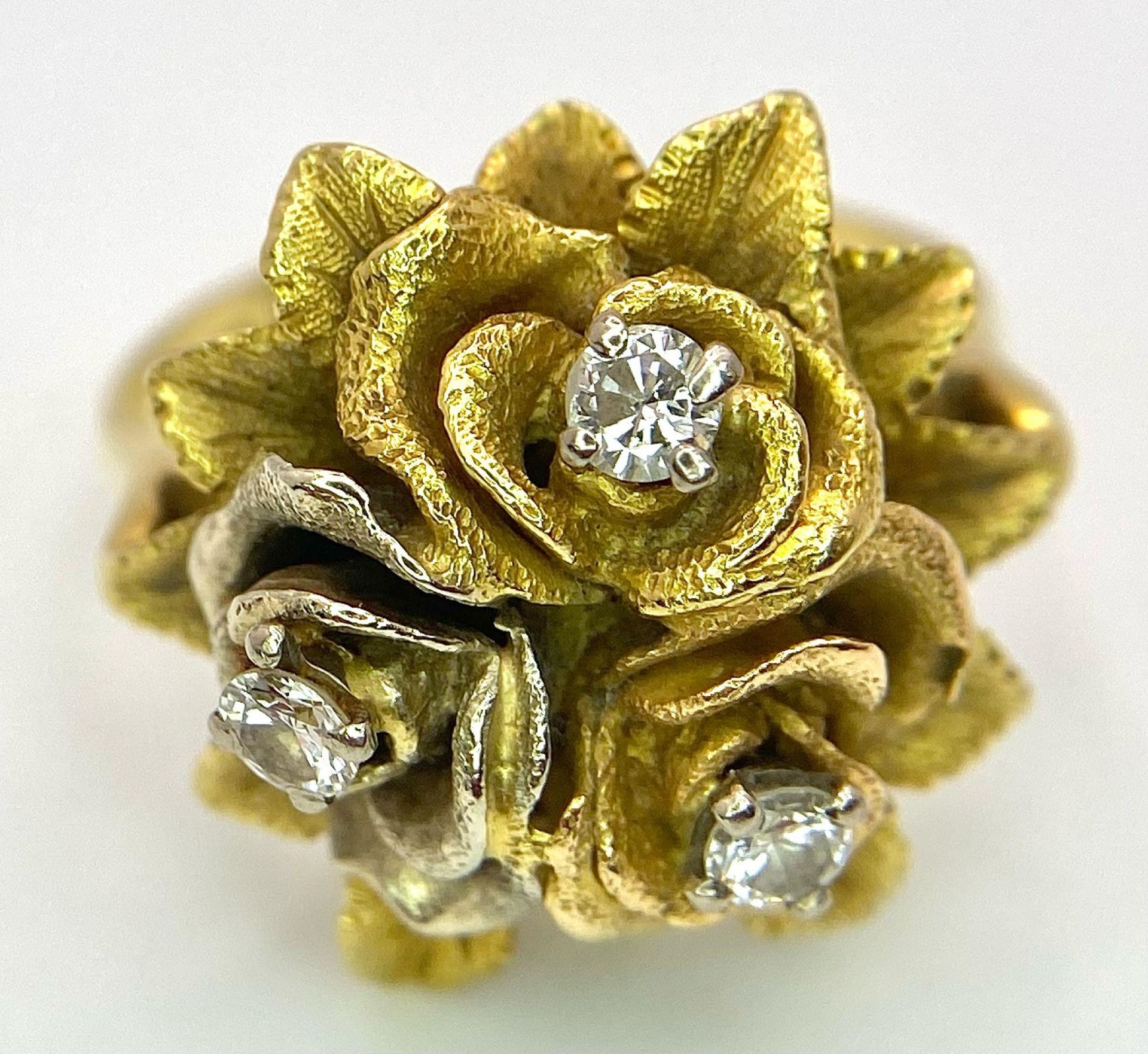 An 18K Yellow Gold and Diamond Floral Design Ring. A rich cluster of golden petals give sanctuary to - Image 6 of 9