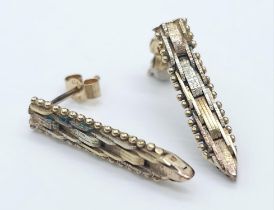 A Pair of 9K Tri-Colour Gold Dagger-Drop Earrings. 2.37g total weight. 22mm drop