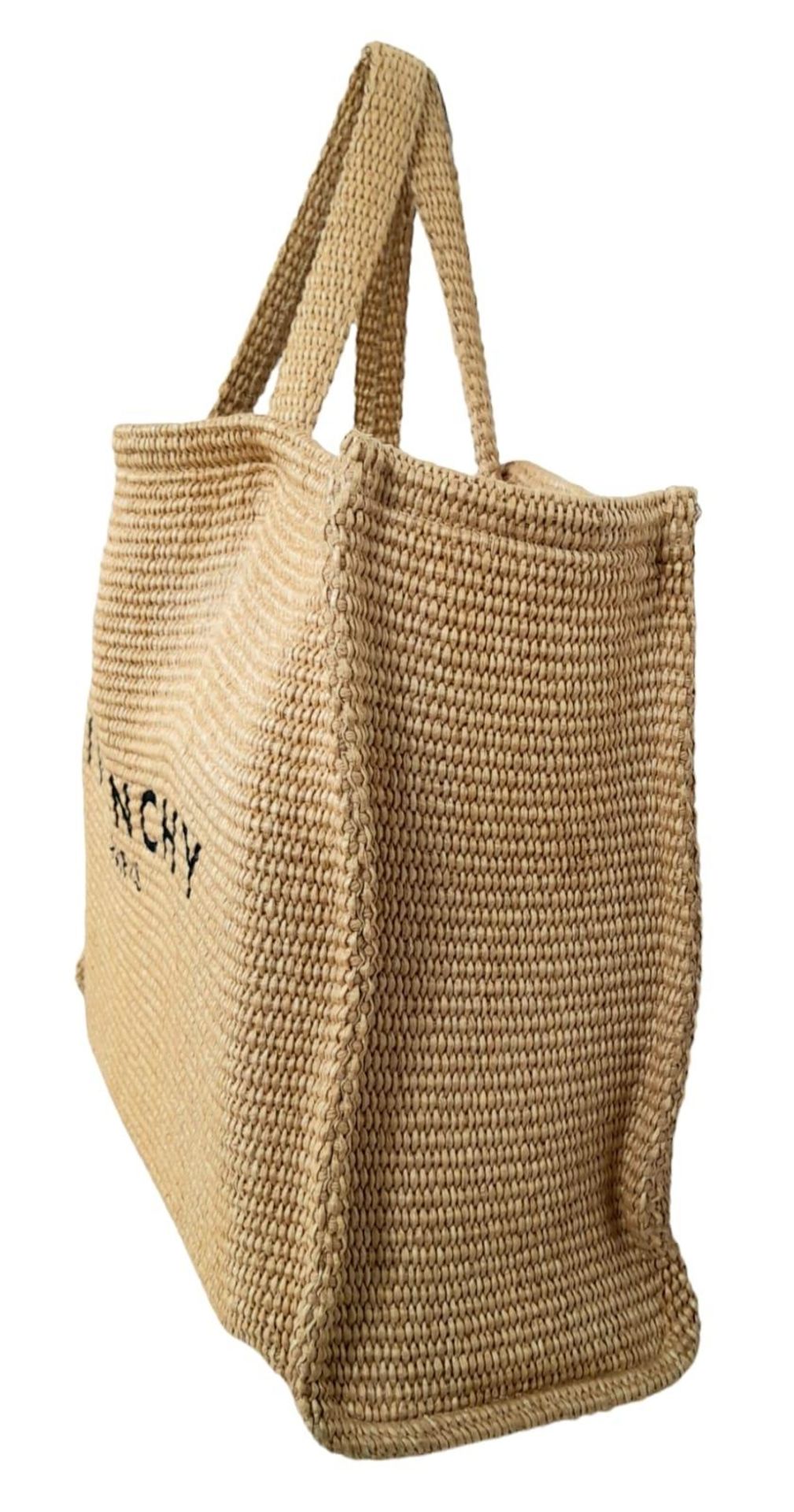 A Givenchy Raffia Tote Bag. Woven textile exterior with two straps. Woven textile interior with an - Image 2 of 5