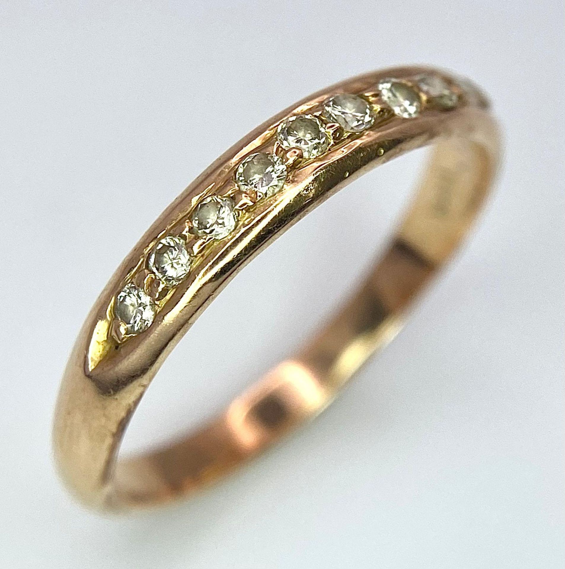 A 14k Yellow Gold Diamond Half Eternity Ring. Size N. 2.1g total weight.