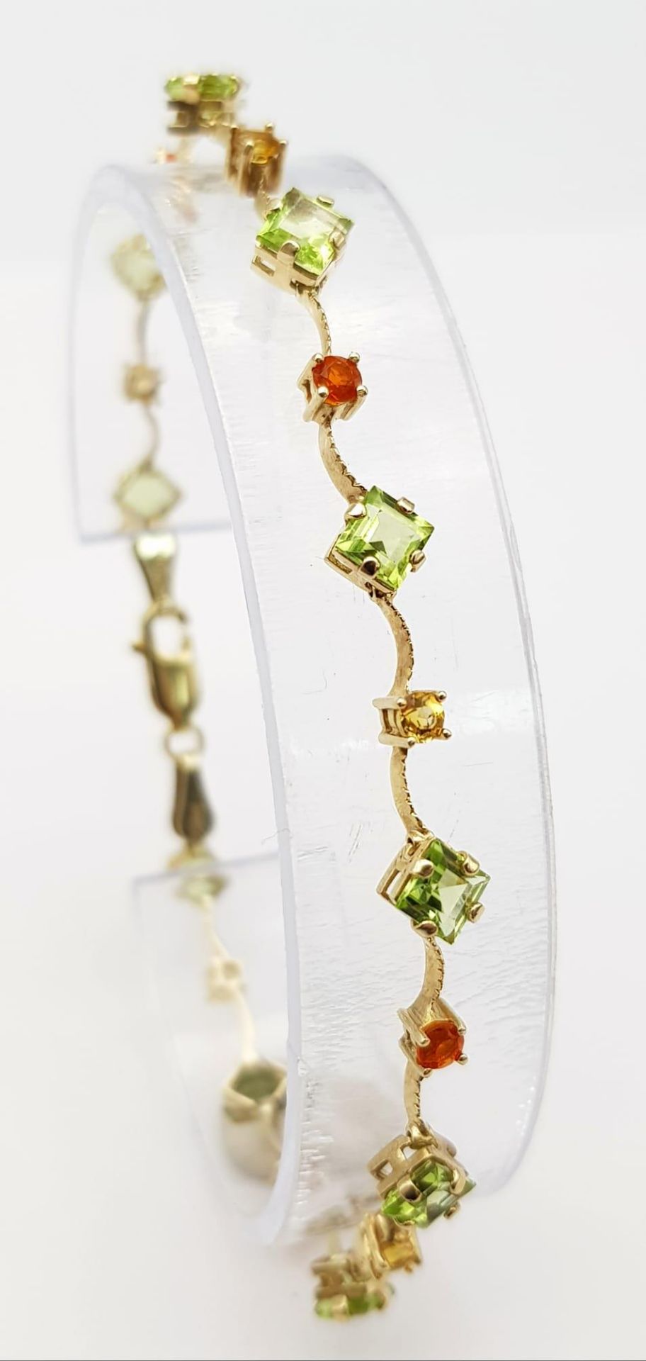 A 14K Yellow Gold Multi Coloured Gemstone Set Bracelet. 18.5cm length, 4.2g total weight. Ref: SC