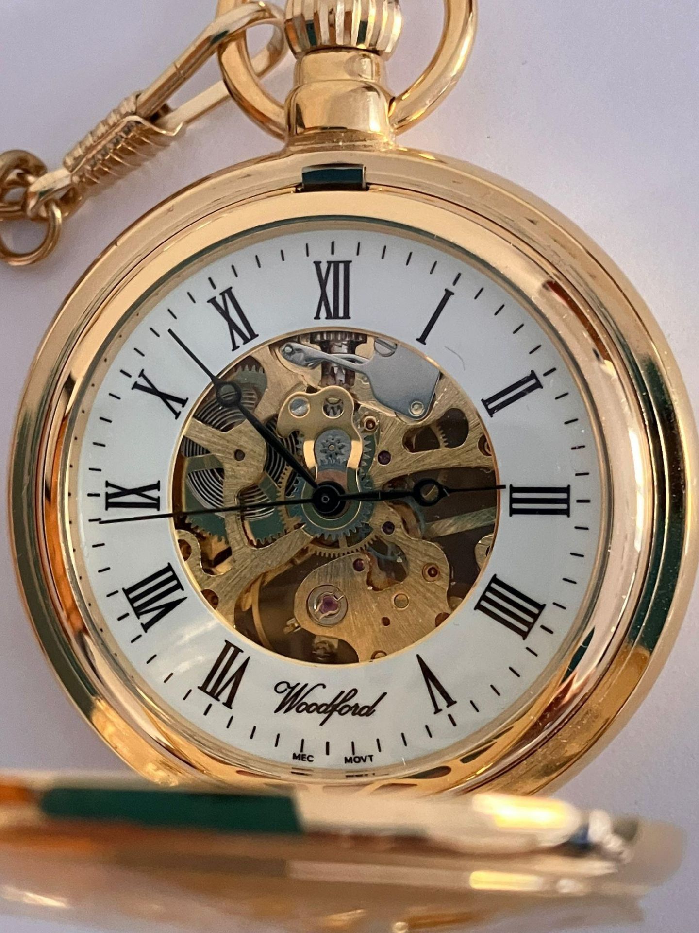 A WOODFORD SKELETON HALF HUNTER POCKET WATCH. Gold Plated finish with Skeleton Front and back. - Bild 5 aus 5