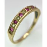 A 9K GOLD RUBY AND DIAMOND RING . 1.6gms size N