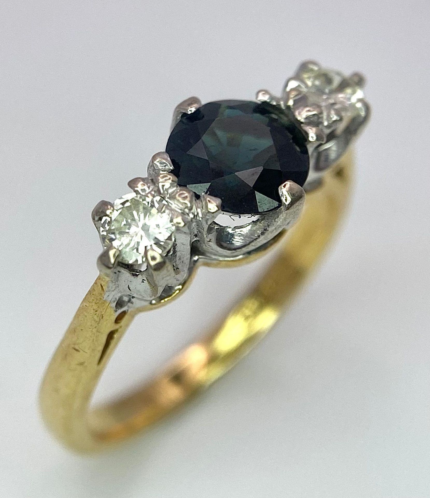 An 18K White Gold, Diamond and Sapphire Ring. Central round cut sapphire with a diamond either side. - Image 3 of 6