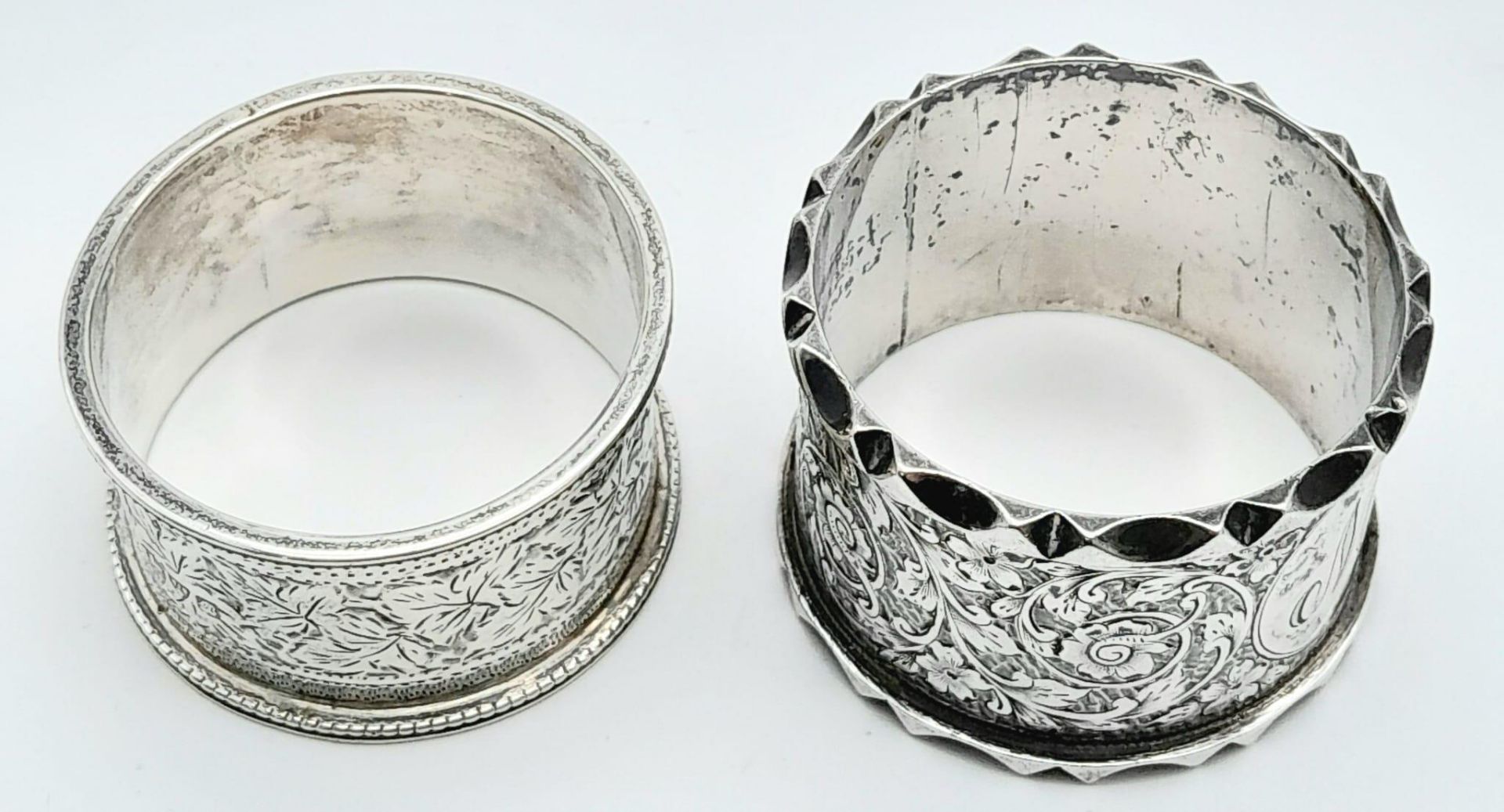 A collection of 2 antique sterling silver napkin holders with fabulous floral engravings. Come - Image 4 of 6