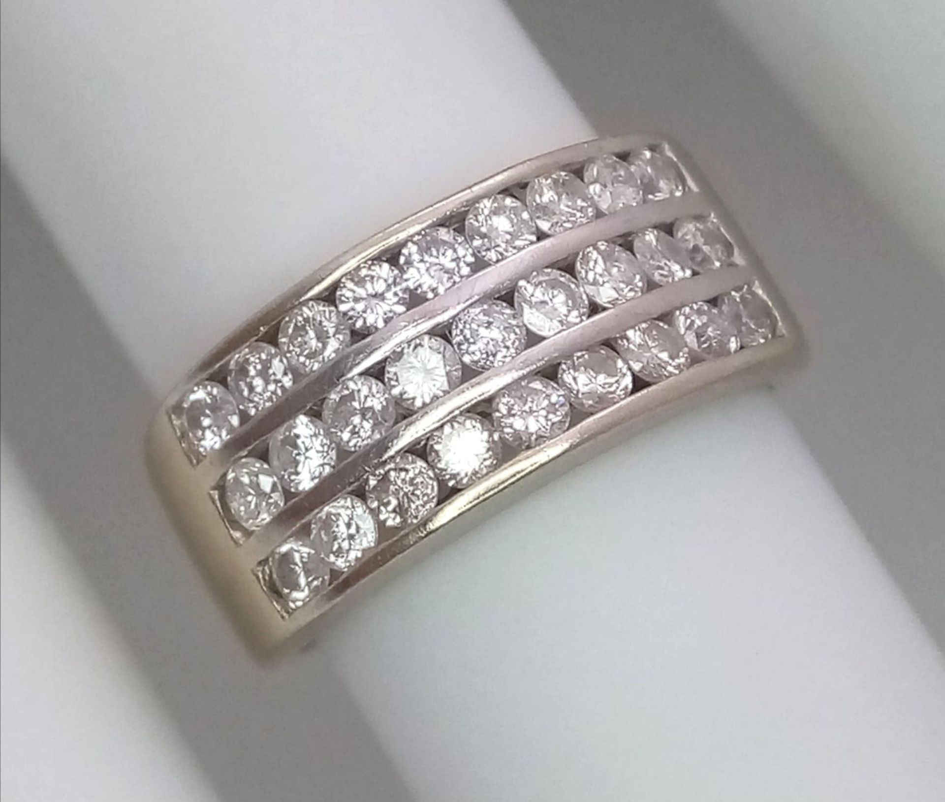 A well made 18 K yellow gold ring with three channels filled with round cut diamonds. Size: H, - Image 9 of 18