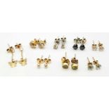 Eight pairs of 9 K yellow gold stud earring with diamonds, sapphires, peridot, aquamarine, etc.