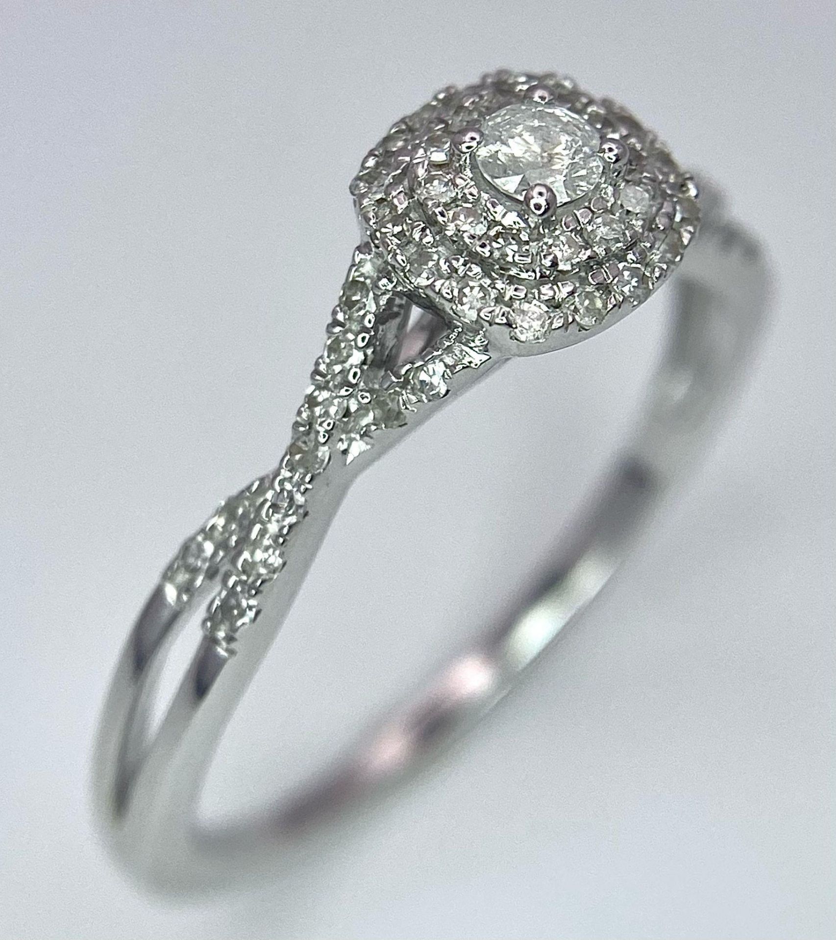 A 9K White Gold Diamond Double Halo Ring. 0.30ctw, size P, 2.2g total weight. Ref: 8447