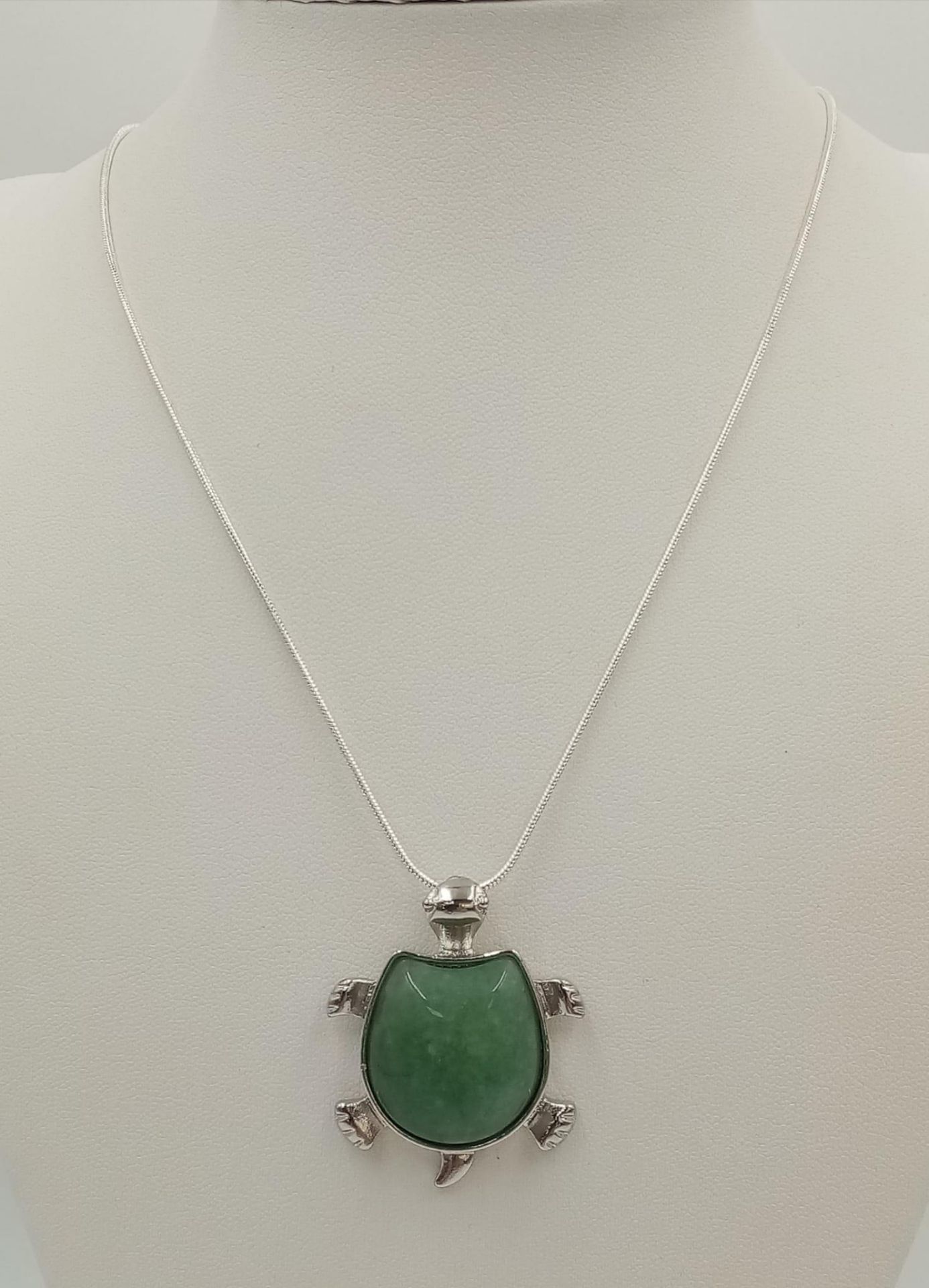 A Green Jade Turtle Pendant on a 925 Silver Necklace. 4cm pendant. 44cm necklace.