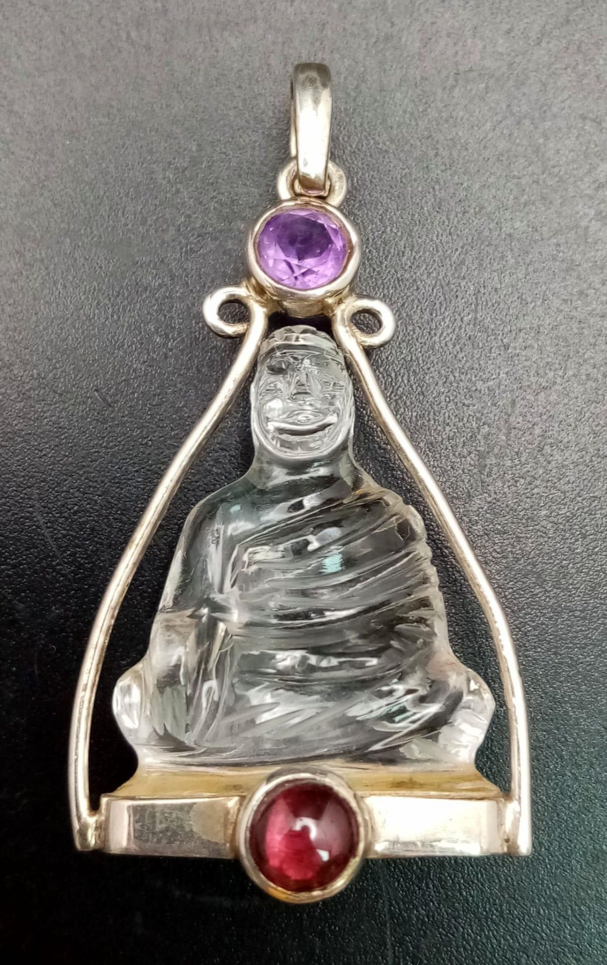 A Silver Mounted Carved Crystal, Ruby and Amethyst Buddha/Deity Pendant, 4.5cm Length. Gross - Image 2 of 5