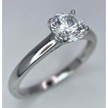 A sterling silver solitaire ring with a round cut cubic zirconium. Size: N, weight: 2 g.