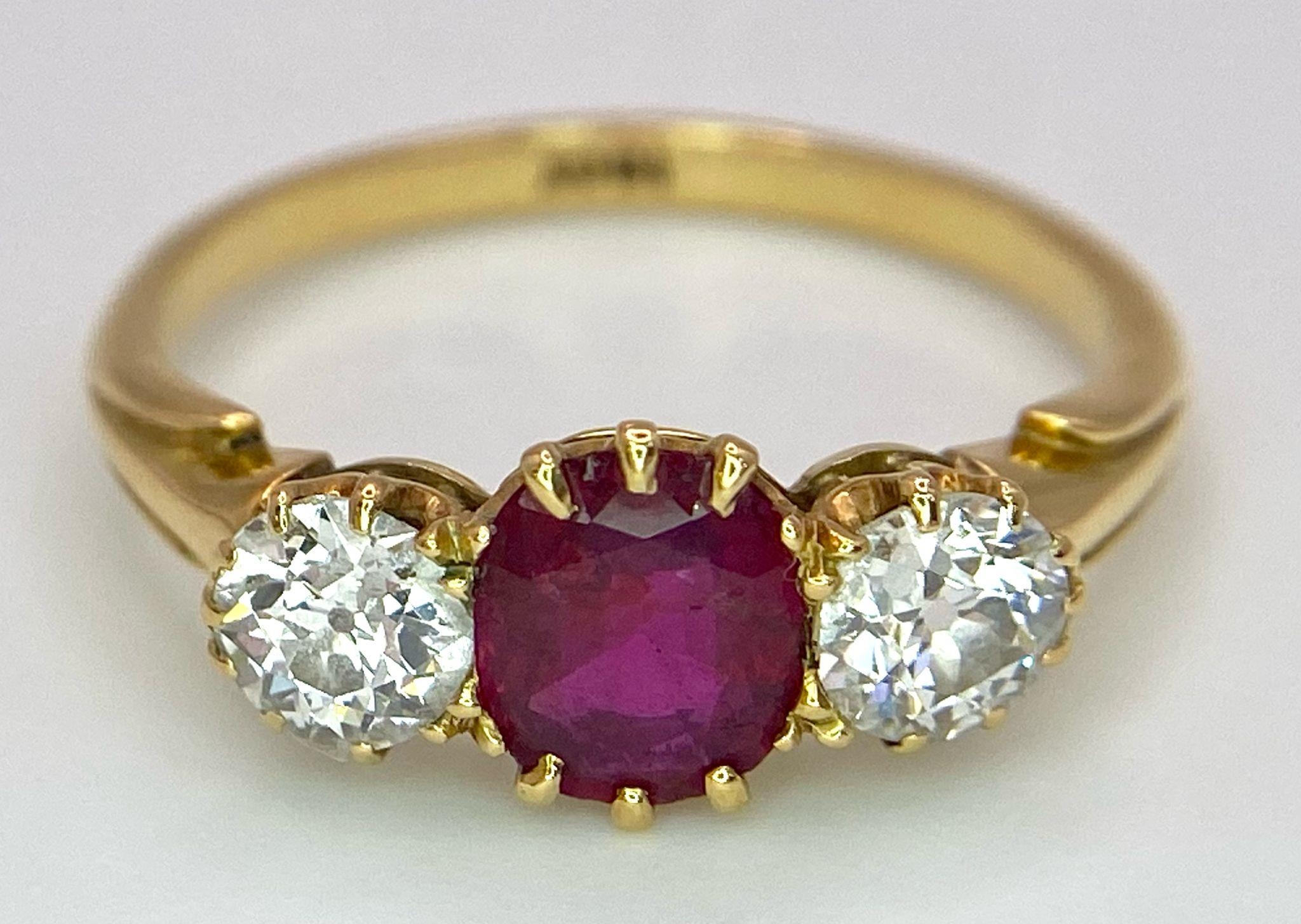 A Mesmerising 18K Yellow Gold, Ruby and Diamond Ring. A deep red oval cut ruby sits central - Image 4 of 9