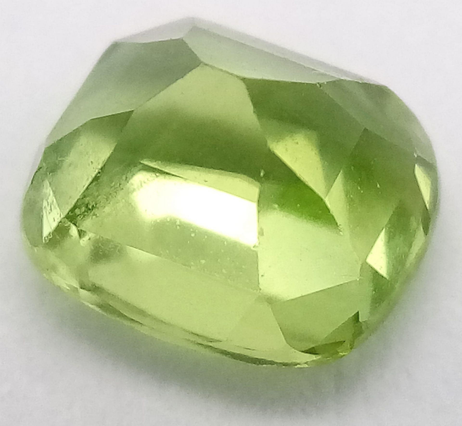 A 1.96ct Pakistan Natural Peridot, in the Cushion shape cut. Comes with the GFCO Swiss - Image 3 of 5