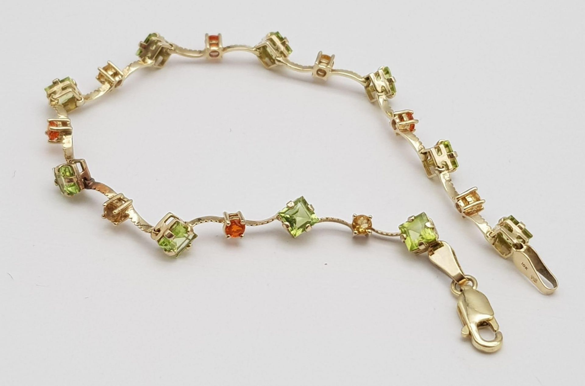 A 14K Yellow Gold Multi Coloured Gemstone Set Bracelet. 18.5cm length, 4.2g total weight. Ref: SC - Image 5 of 6