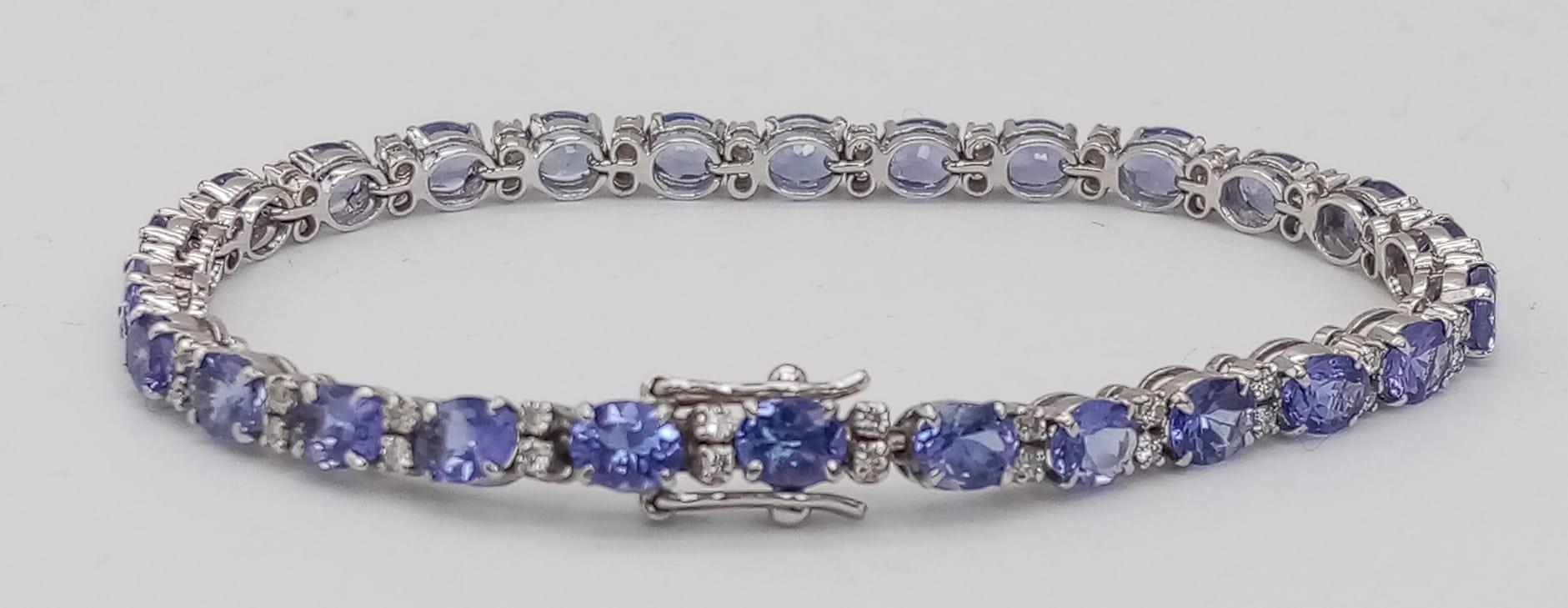 A spectacular 18 K white gold bracelet with oval cut tanzanite gems and round cut diamonds. - Image 2 of 16