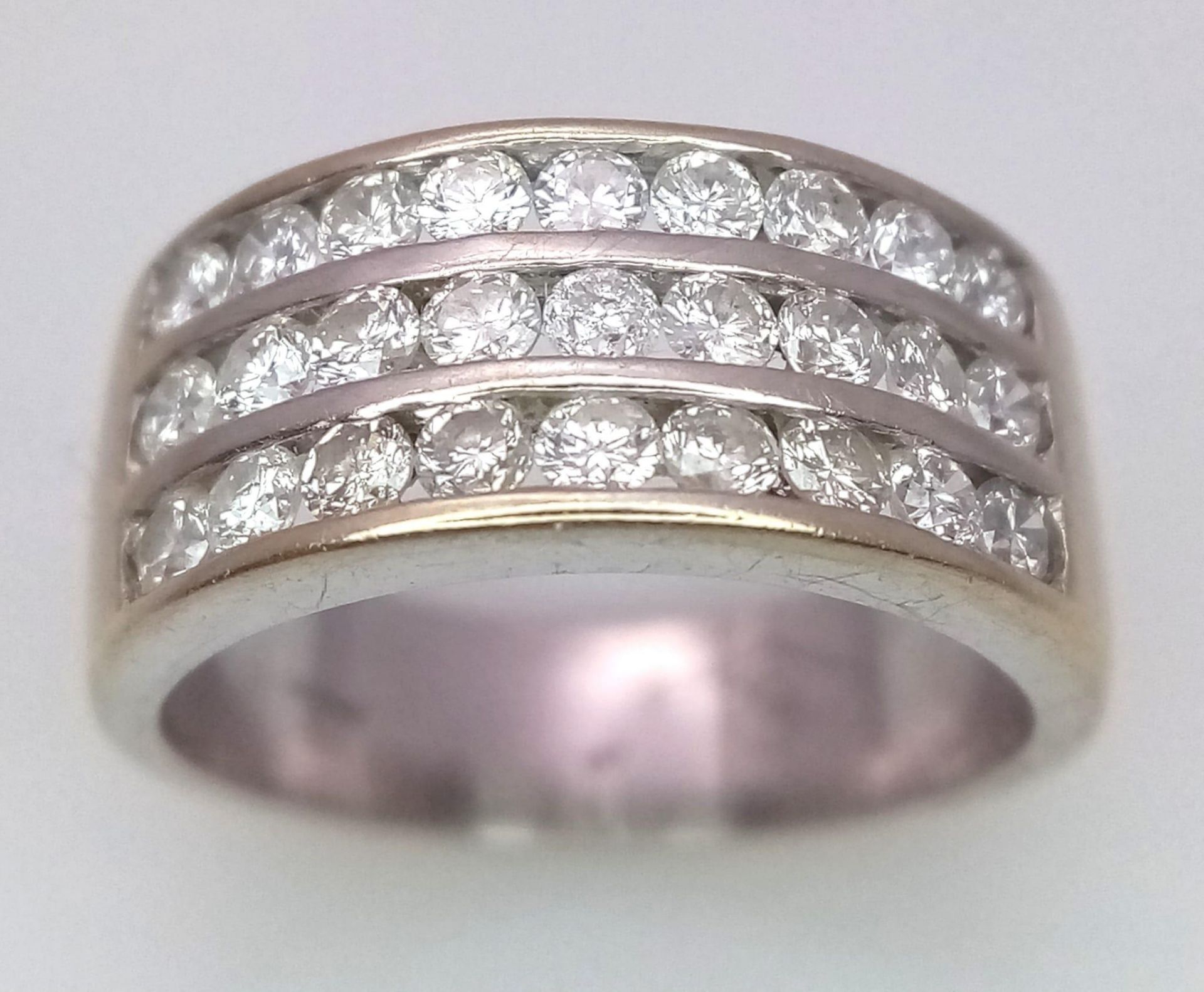 A well made 18 K yellow gold ring with three channels filled with round cut diamonds. Size: H, - Image 2 of 18