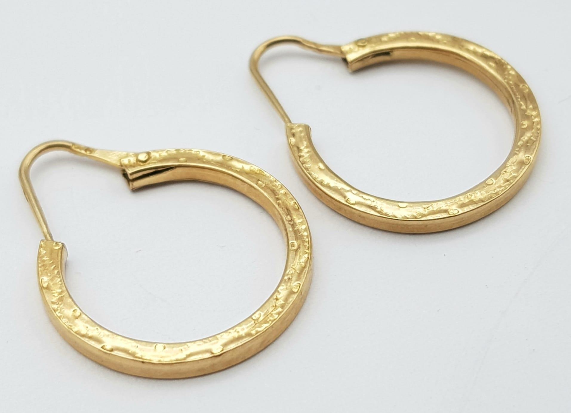 A Pair of 9K Yellow Gold Small Decorative Hoop Earrings. 1.92g weight.