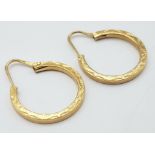 A Pair of 9K Yellow Gold Small Decorative Hoop Earrings. 1.92g weight.