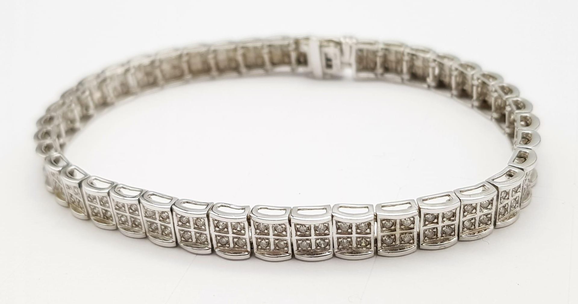 A 9K White Gold Diamond Set Bracelet, with Under Safety Catch Fitting. 1ctw, 19cm length, 12.7g