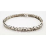 A 9K White Gold Diamond Set Bracelet, with Under Safety Catch Fitting. 1ctw, 19cm length, 12.7g