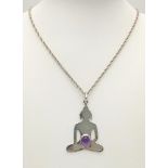 A Sterling Silver Amethyst Cabochon Set Deity Pendant Necklace. Pendant Measures 4.5cm Drop and is