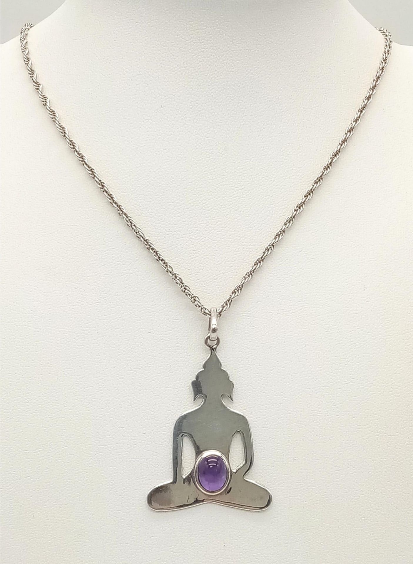 A Sterling Silver Amethyst Cabochon Set Deity Pendant Necklace. Pendant Measures 4.5cm Drop and is