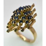 A vintage, 14 K yellow gold ring with a crown of Ceylon, round cut, vivid dark blue sapphires,
