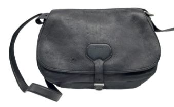 A Prada Black Leather Crossbody Satchel Bag. Textured exterior with buckled flap. Spacious leather