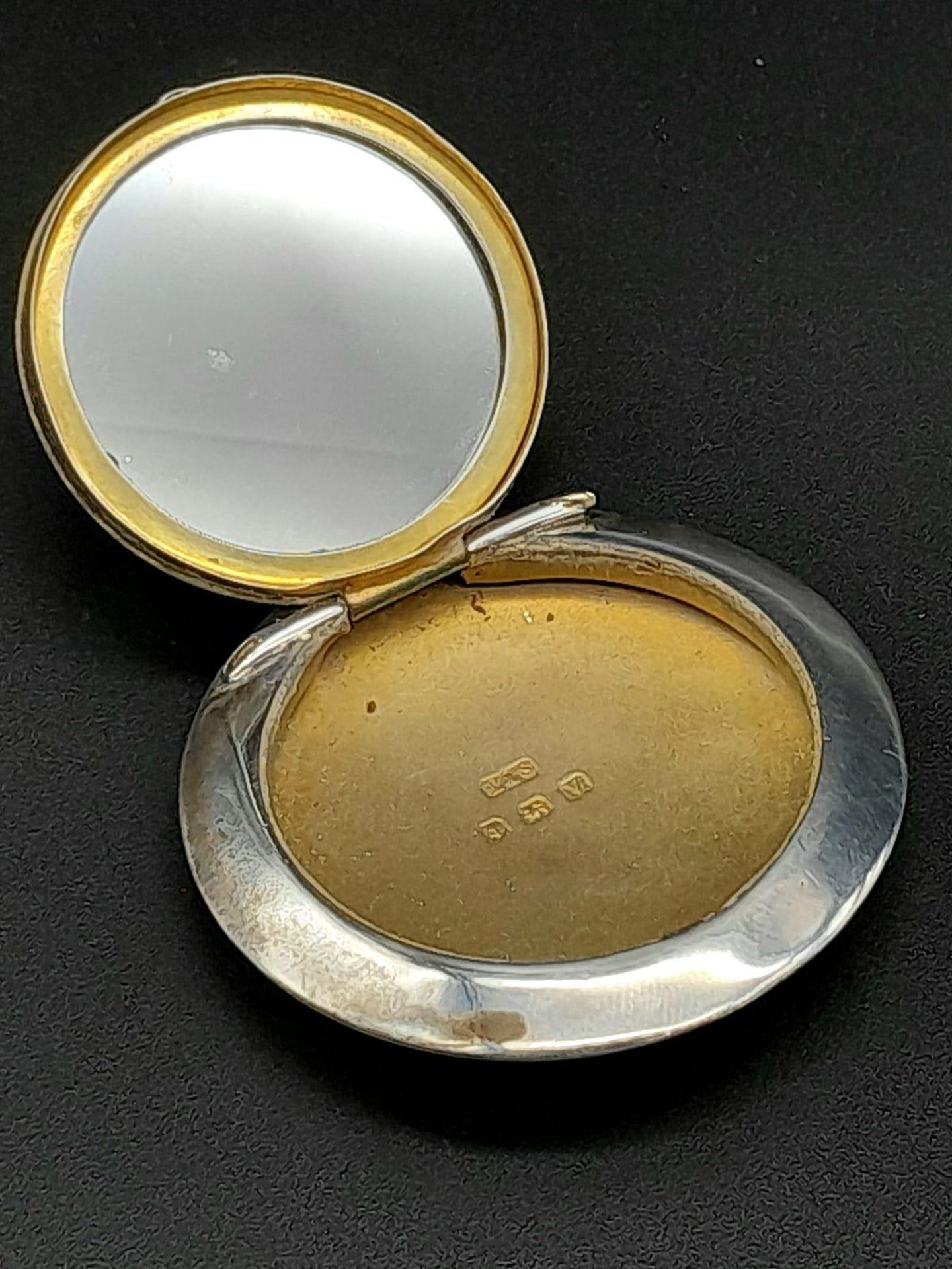 A Circular Lidded Small Pill Box - Birmingham hallmarks. 5cm. 16g