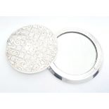 A white metal (untested) CRISTOFLE ladies mirror, diameter: 70 mm, weight: 138 g.
