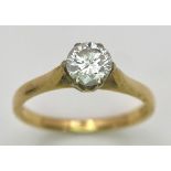 An 18K Yellow Gold Diamond Solitaire Ring. 0.75ct brilliant round cut diamond. Size N. 2.65g total