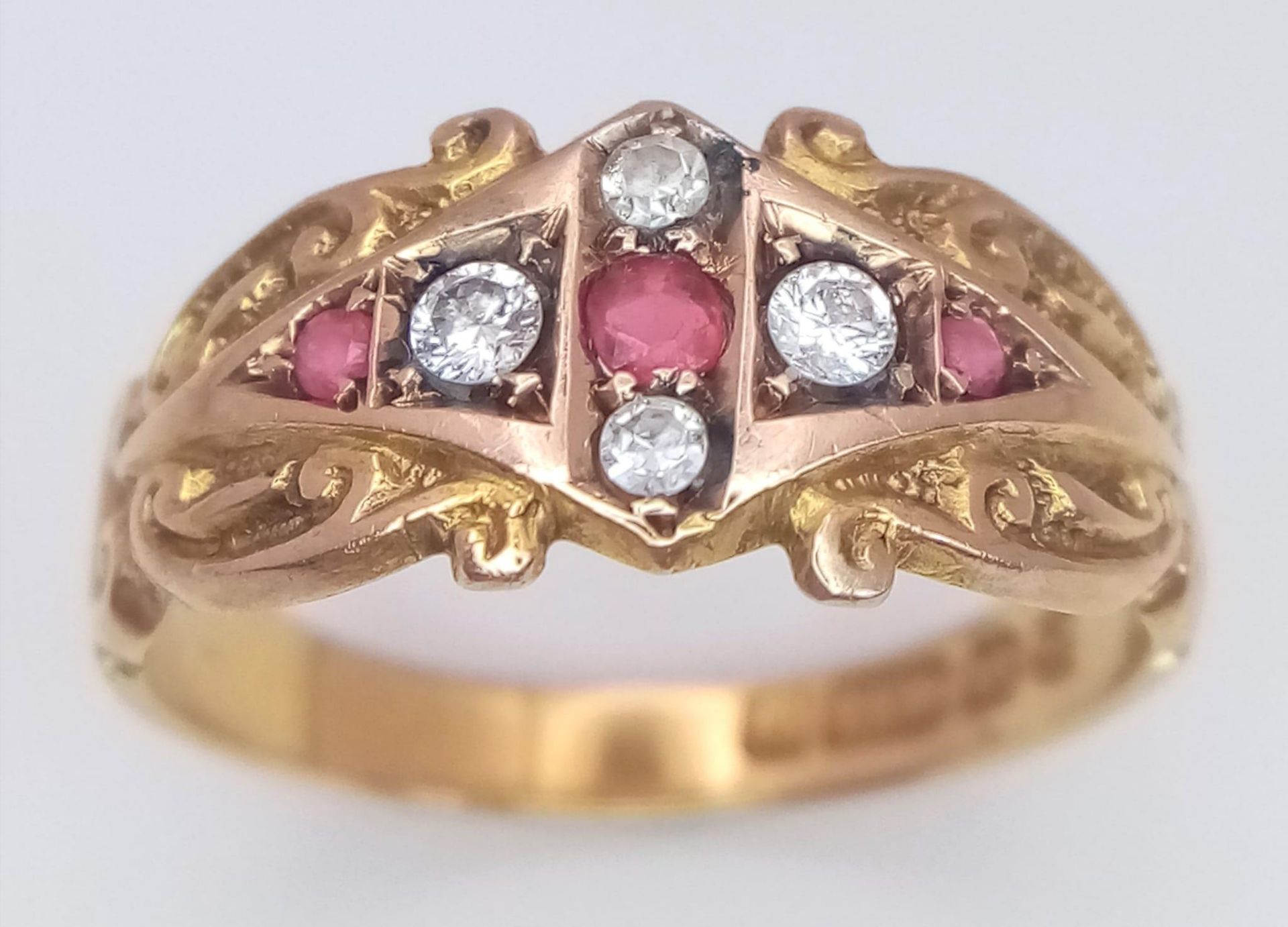 AN ANTIQUE 15K YELLOW GOLD ANTIQUE DIAMOND & RUBY RING. 3G. SIZE L. HALLMARKED CHESTER 1904.