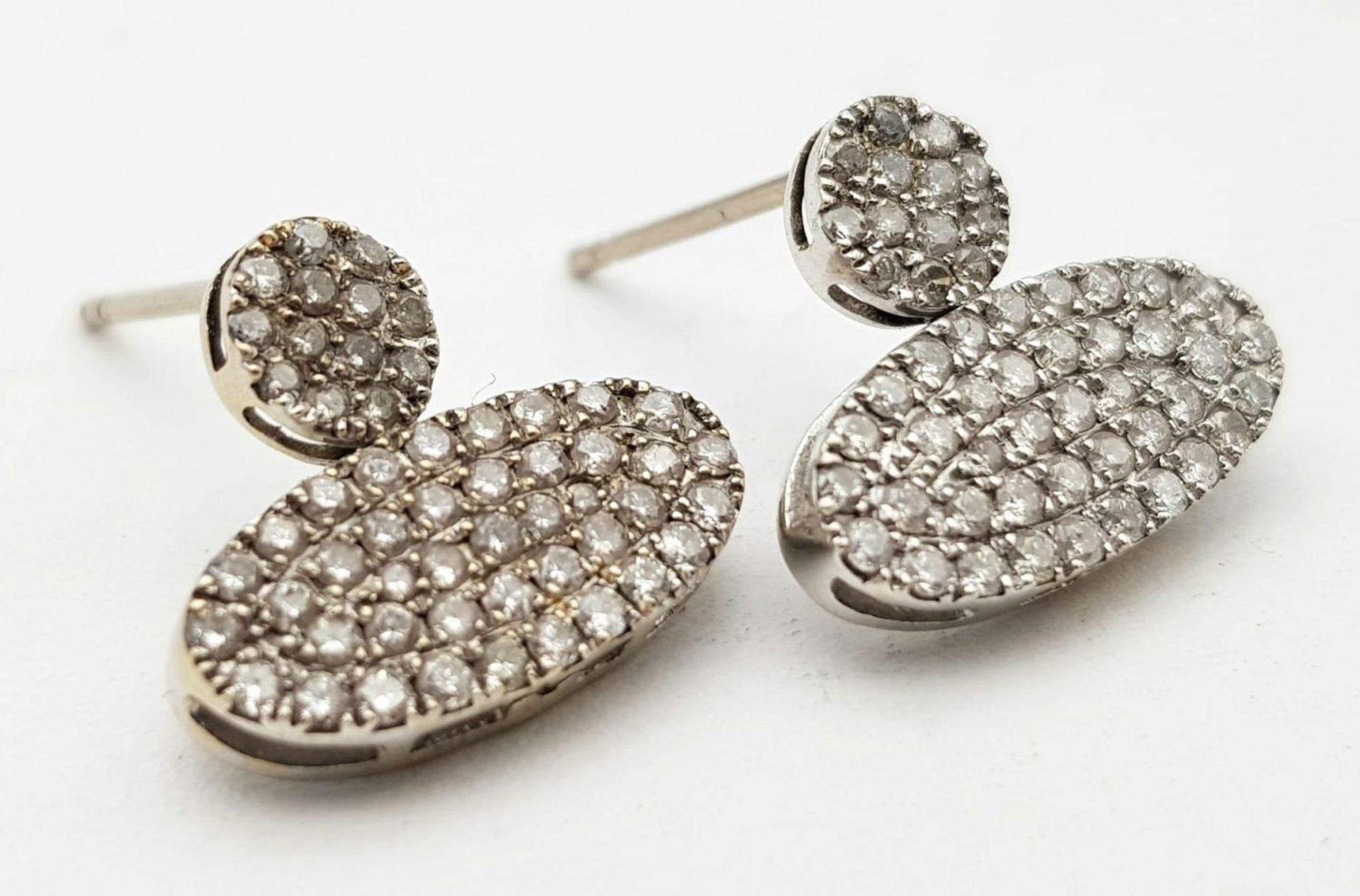 A PAIR OF DIAMOND ENCRUSTED EARRINGS SET IN PLATINUM . 2.2gms - Image 3 of 6