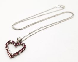 A fancy 925 silver Garnet cluster heart pendant on silver sparkling chain. Total weight 2.7G.