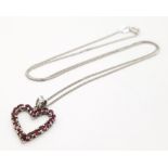 A fancy 925 silver Garnet cluster heart pendant on silver sparkling chain. Total weight 2.7G.