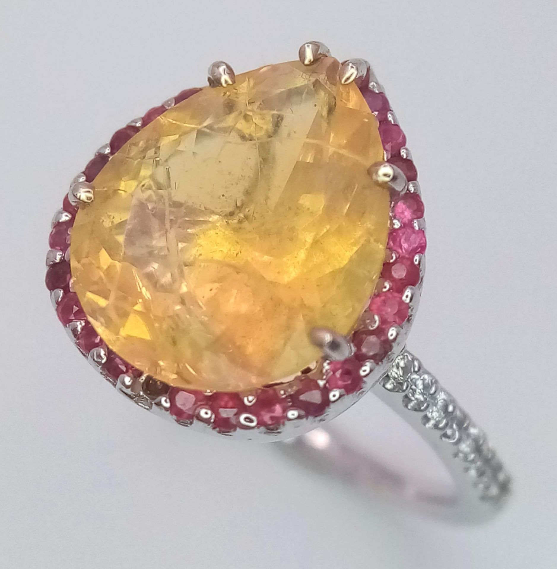 An 18 K white gold ring with a large, pear cut, fire opal exhibiting orange and green hues, - Image 4 of 9