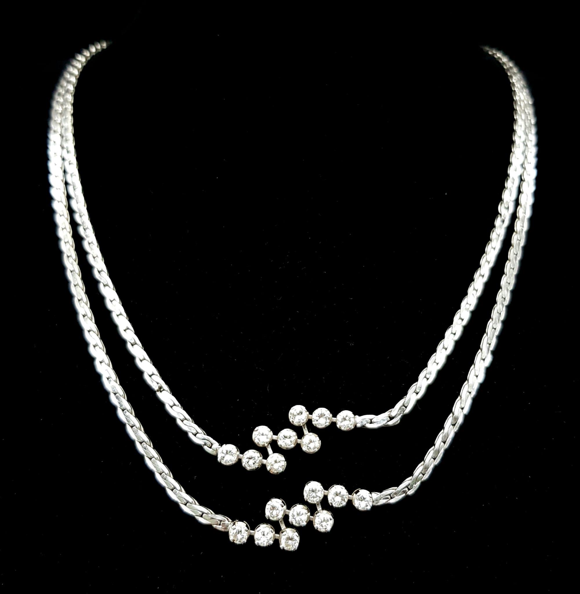 A Beautiful 14K White Gold and Diamond Two Row Necklace. 18 diamonds - 3.6ctw of brilliant round cut